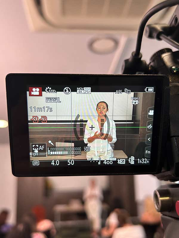 Live streaming control setup at Code4Romania conference with multi-monitor switching