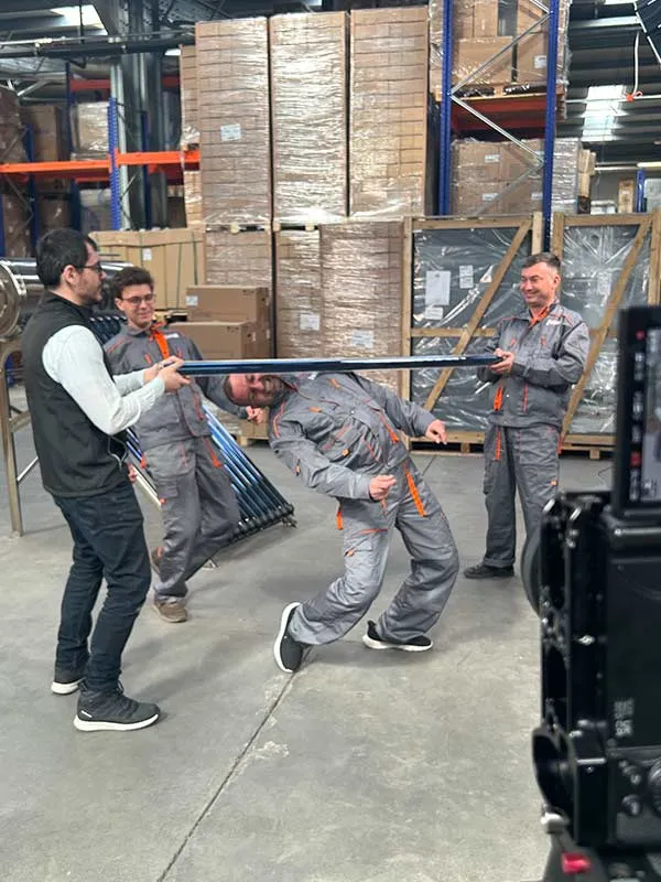 Fun TikTok shoot in Ferroli warehouse with workers doing limbo challenge