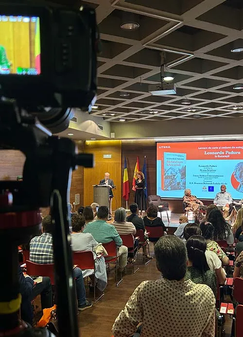 Filming Leonardo Padura book launch event for LITERA Publishing with Romanian and Spanish flags